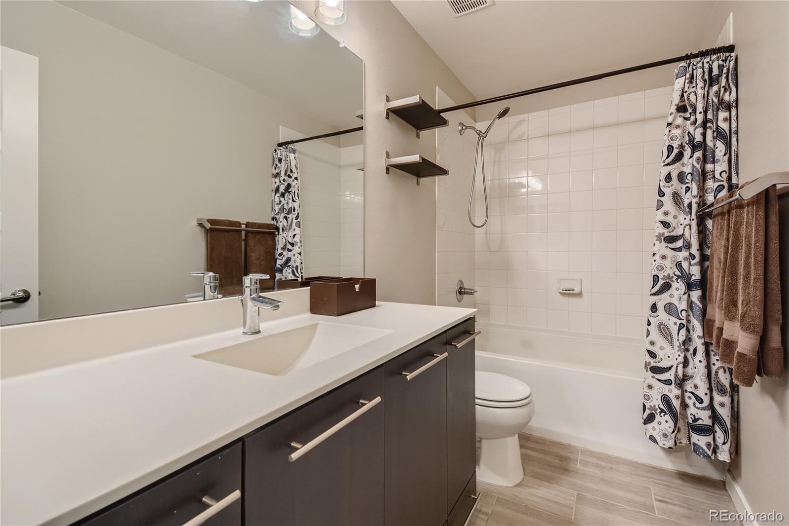 3319 Cranston Circle Highlands Ranch, CO 80126 - Photo 19 of 28 a bathroom with a sink a toilet and shower