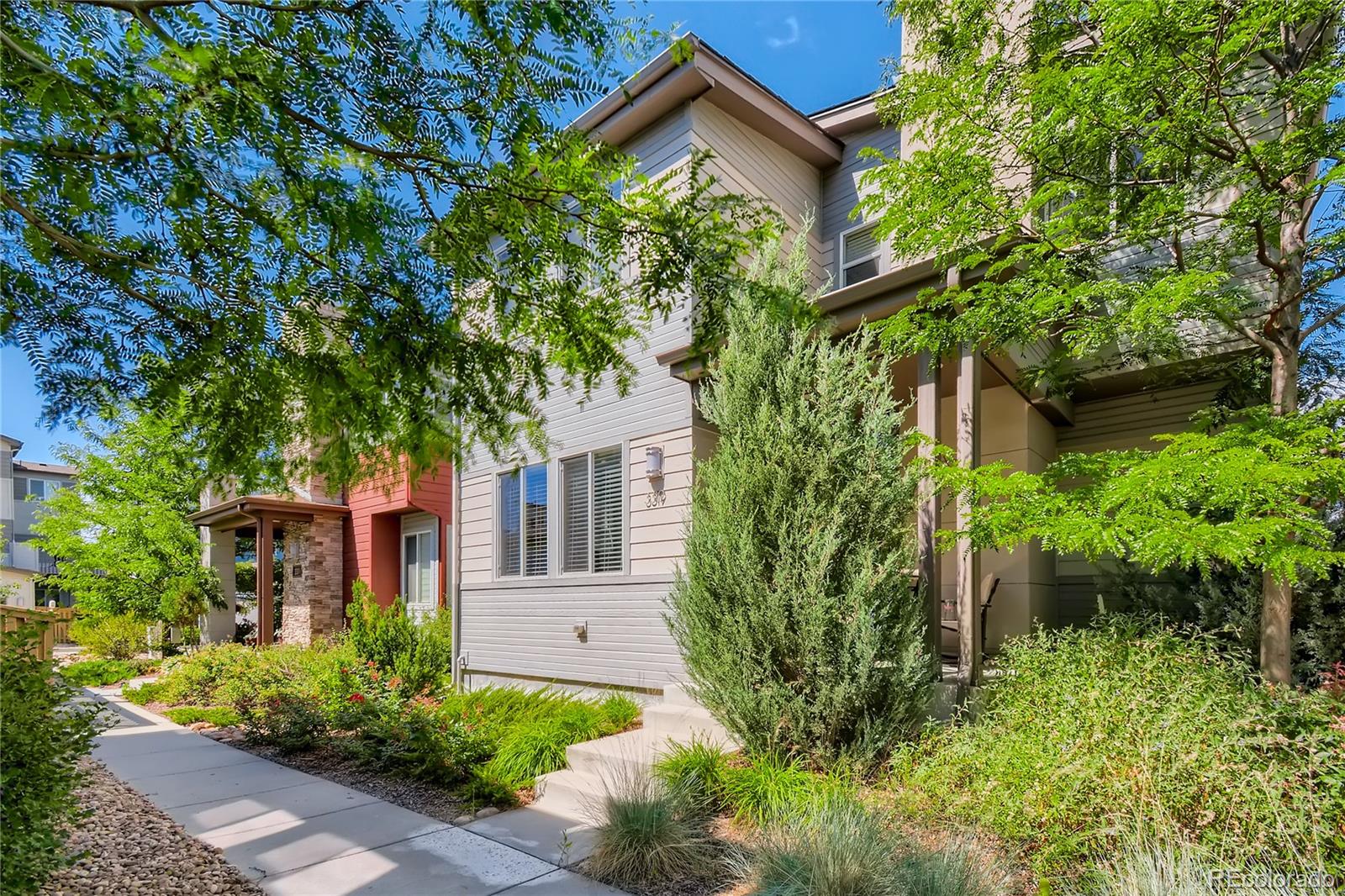 3319 Cranston Circle Highlands Ranch, CO 80126 - Photo 2 of 28 a front view of a house with garden