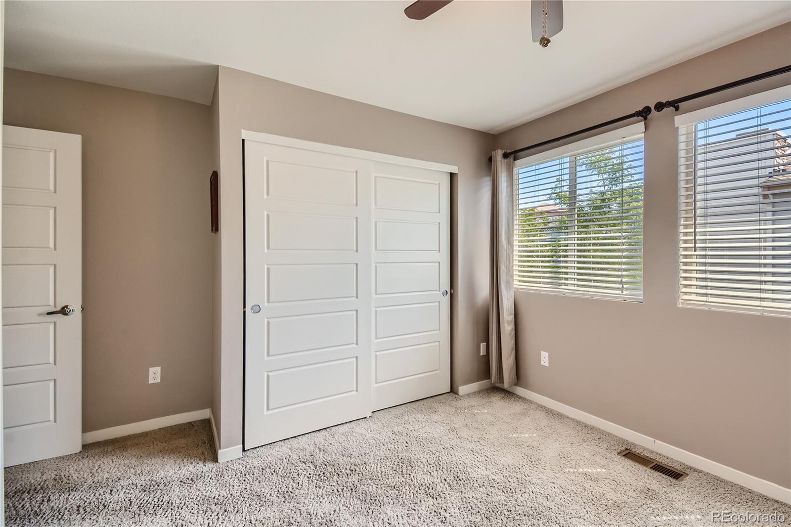 3319 Cranston Circle Highlands Ranch, CO 80126 - Photo 22 of 28 an empty room with windows