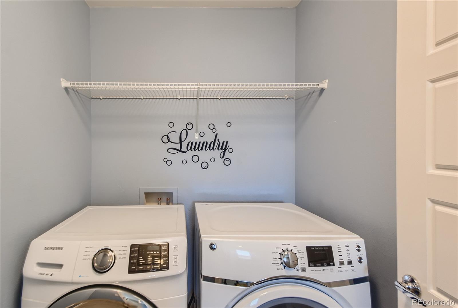 3319 Cranston Circle Highlands Ranch, CO 80126 - Photo 24 of 28 a utility room with dryer and washer