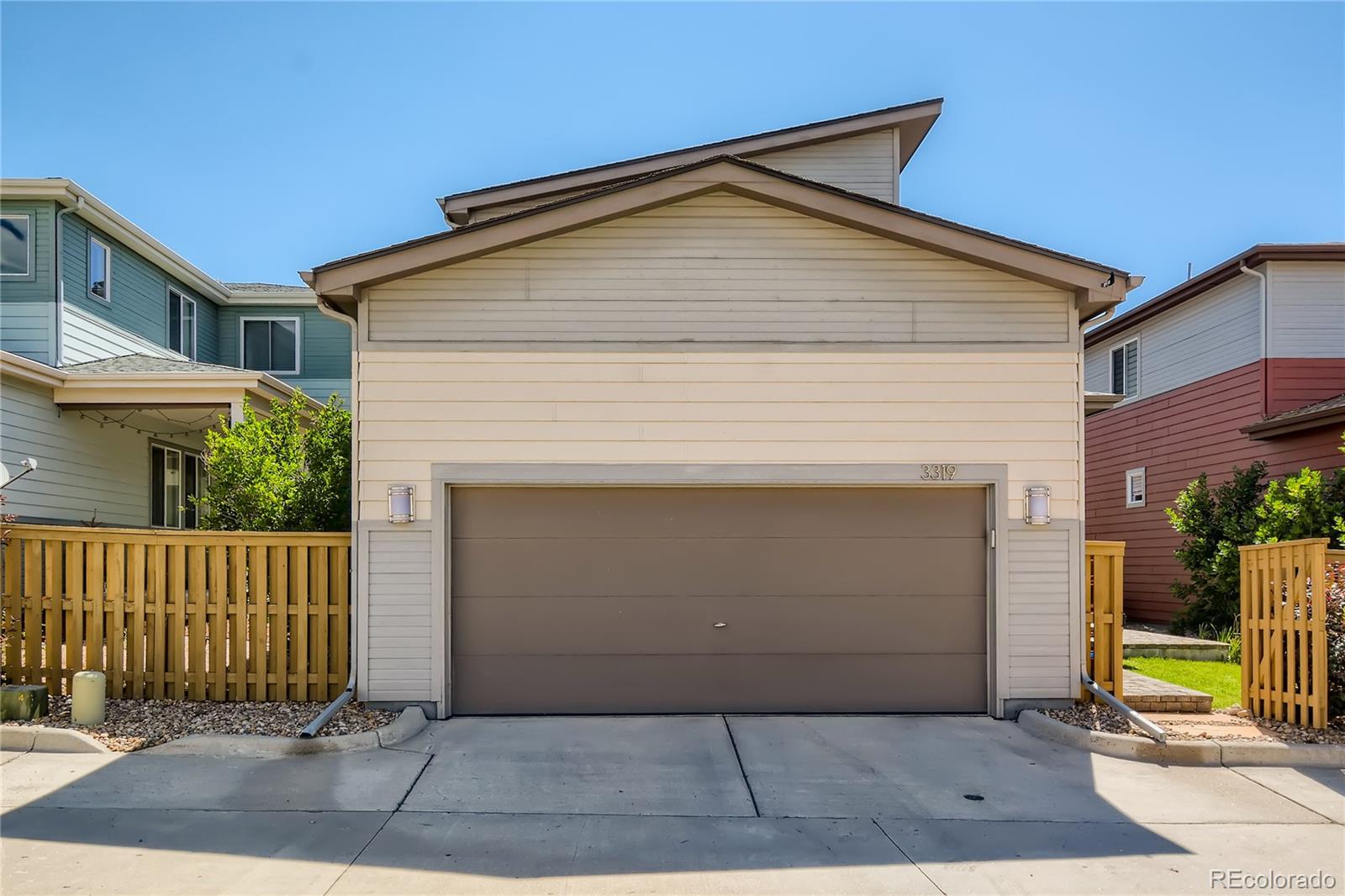 3319 Cranston Circle Highlands Ranch, CO 80126 - Photo 28 of 28 a front view of a house with a garage