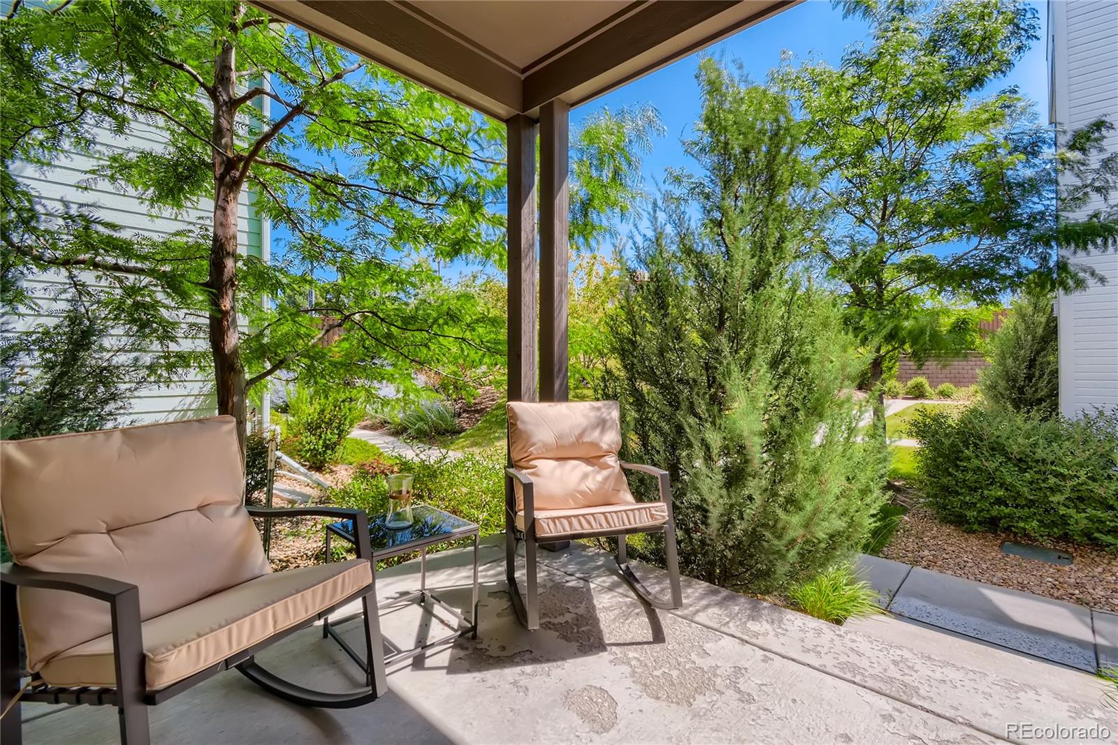 3319 Cranston Circle Highlands Ranch, CO 80126 - Photo 3 of 28 a view of a chairs and table in a backyard