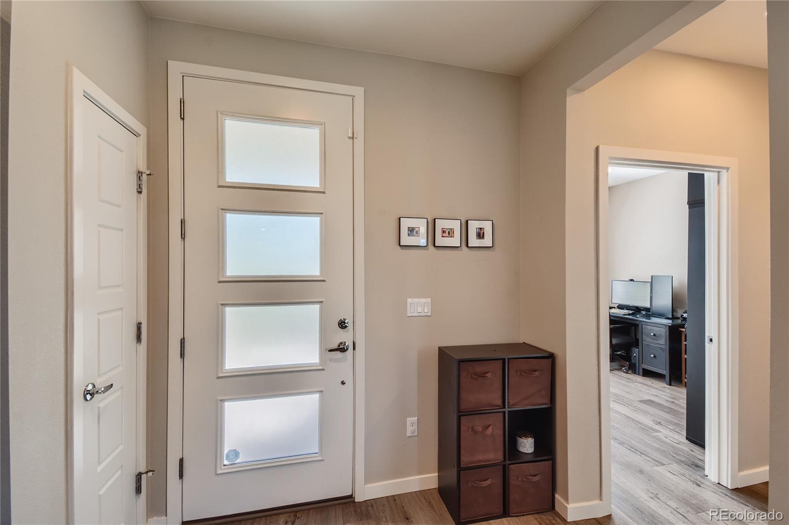 3319 Cranston Circle Highlands Ranch, CO 80126 - Photo 4 of 28 a view of livingroom with furniture and wooden floor