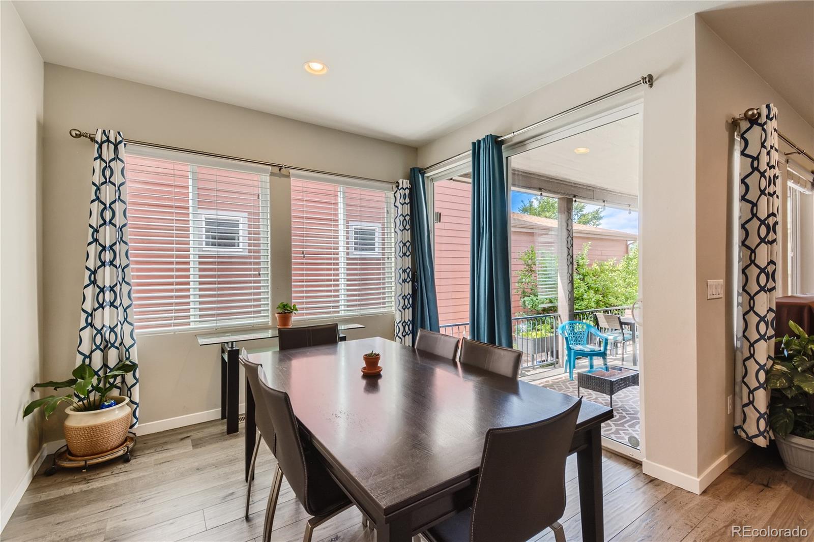 3319 Cranston Circle Highlands Ranch, CO 80126 - Photo 9 of 28 a view of a dining room with furniture window and wooden floor