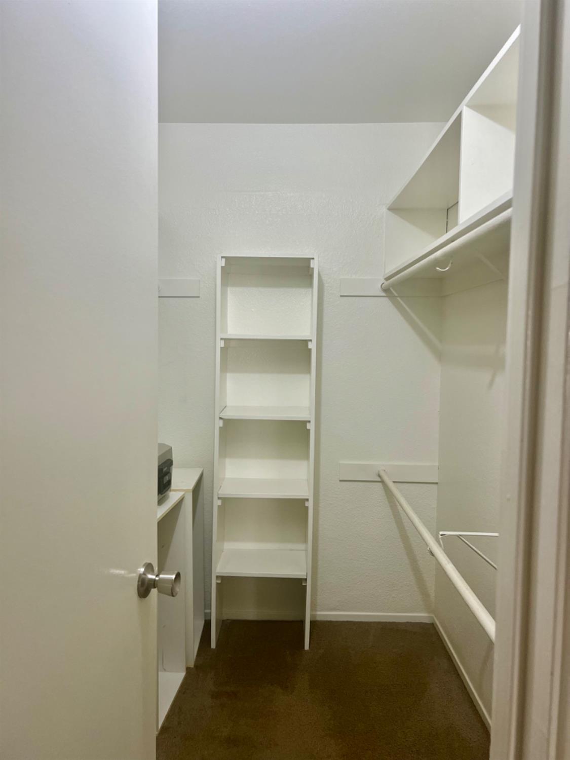 1545 Pyrenees Avenue, Unit 30 Stockton, CA 95210 - Photo 11 of 28 a view of walk in closet with empty racks