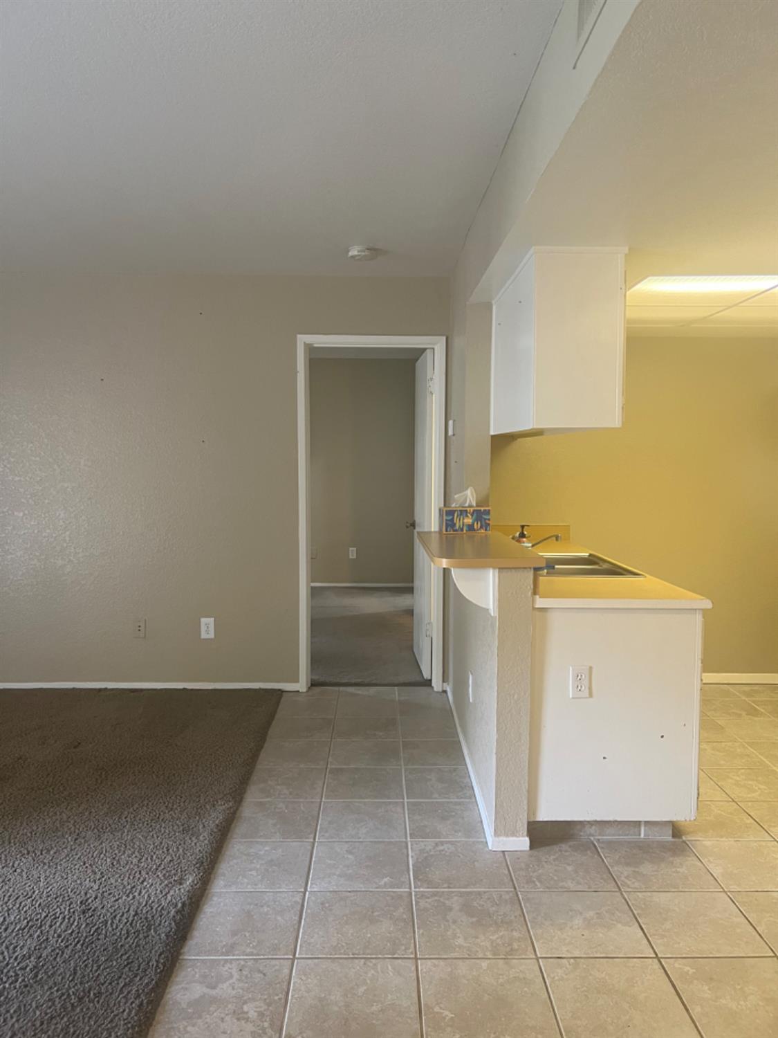 1545 Pyrenees Avenue, Unit 30 Stockton, CA 95210 - Photo 16 of 28 a view of utility room with cabinets