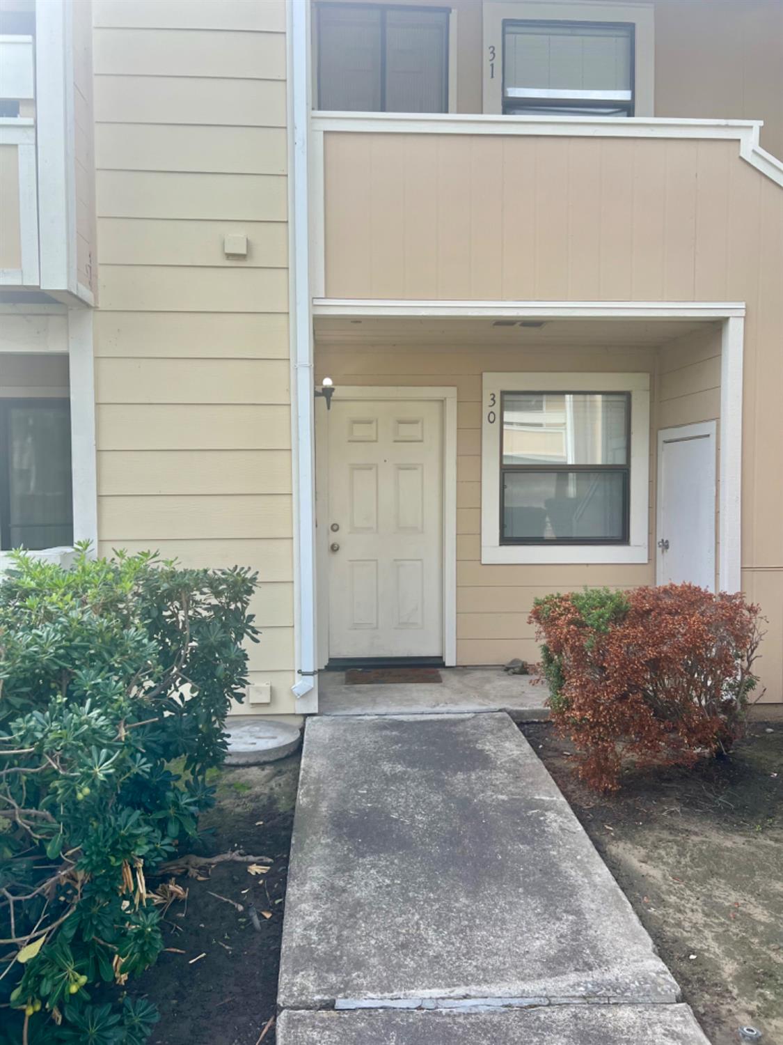 1545 Pyrenees Avenue, Unit 30 Stockton, CA 95210 - Photo 2 of 28 a front view of a house
