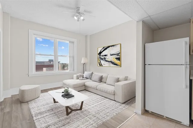 a living room with furniture and a window