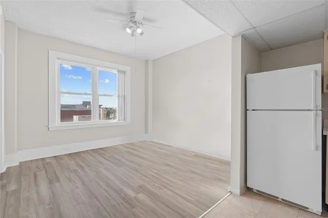 a view of an empty room with a window