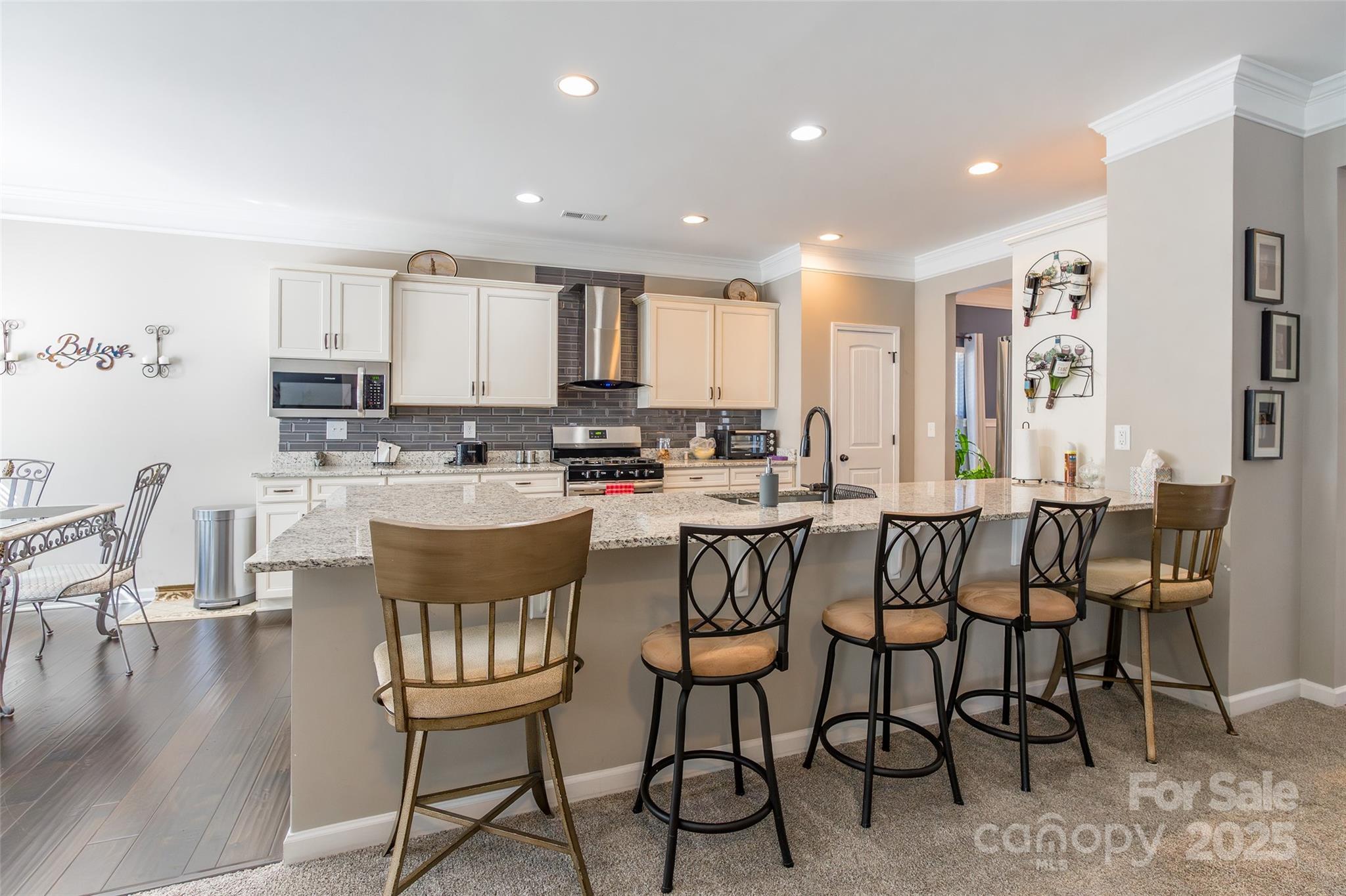 200 Clauser Road South Mount Holly, NC 28120 - Photo 12 of 44 a large kitchen with a table and chairs