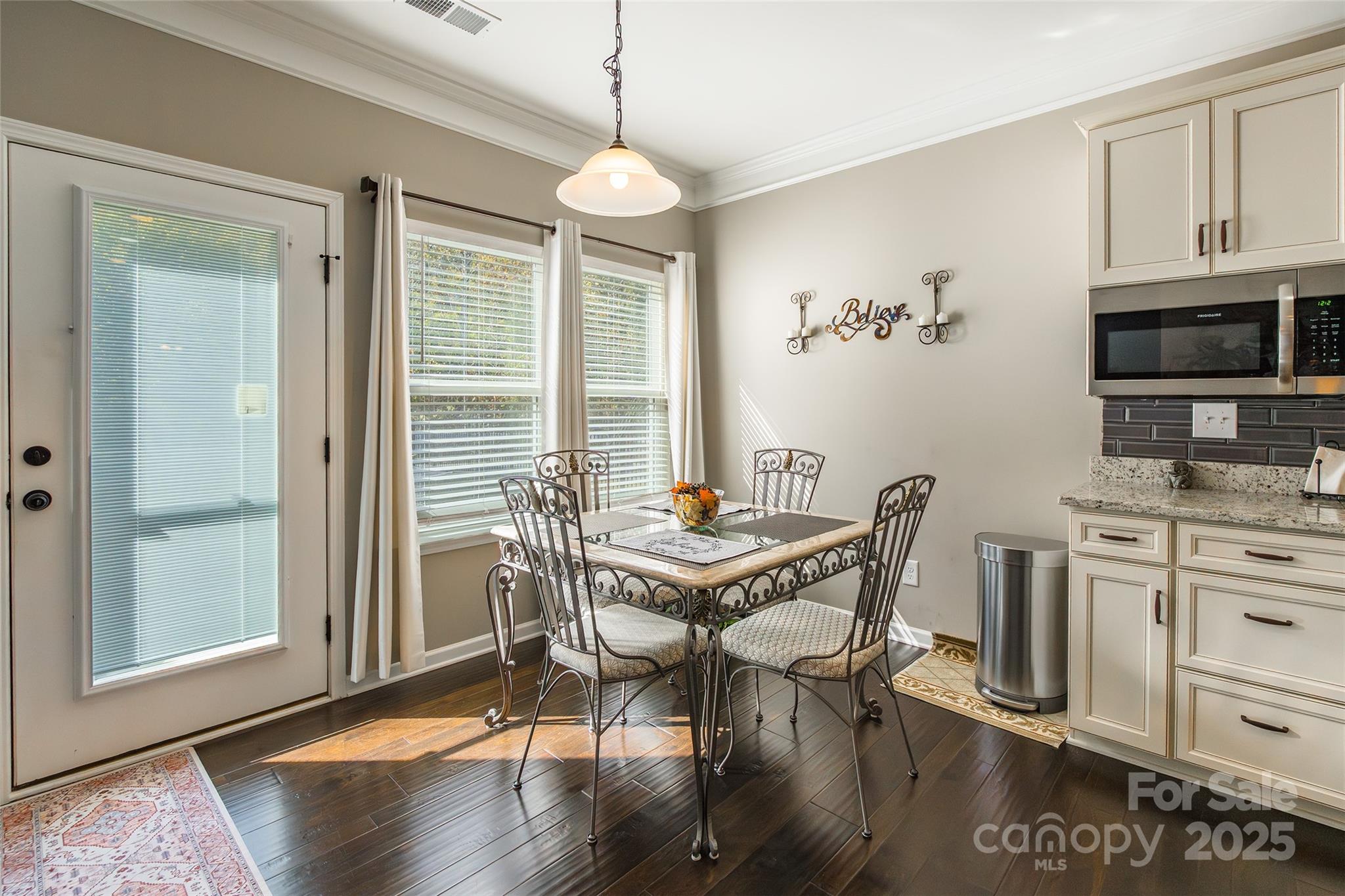 200 Clauser Road South Mount Holly, NC 28120 - Photo 18 of 44 a view of a dining room with furniture window and wooden floor