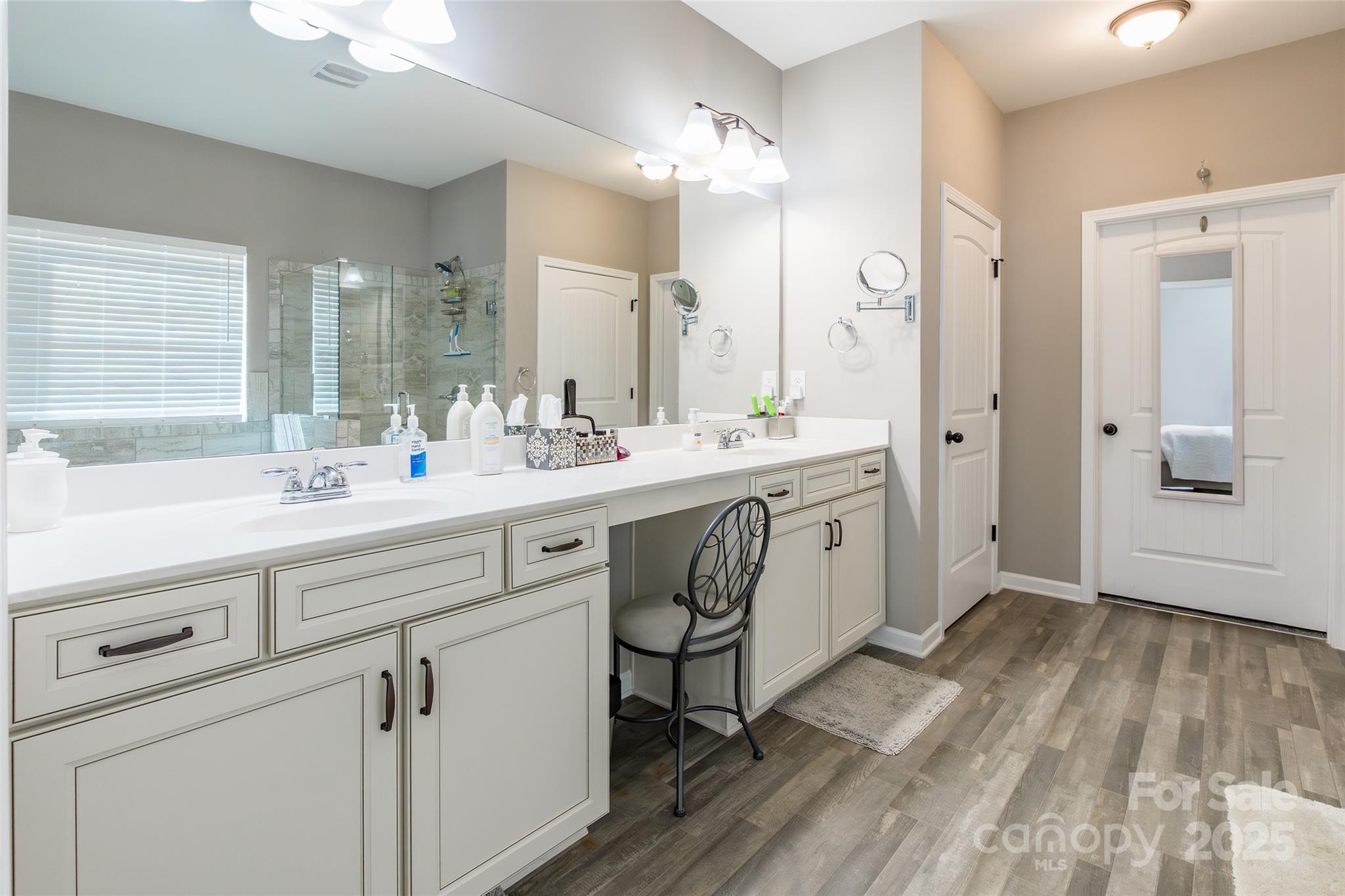 200 Clauser Road South Mount Holly, NC 28120 - Photo 23 of 44 a spacious bathroom with a double vanity sink a mirror and a bathtub