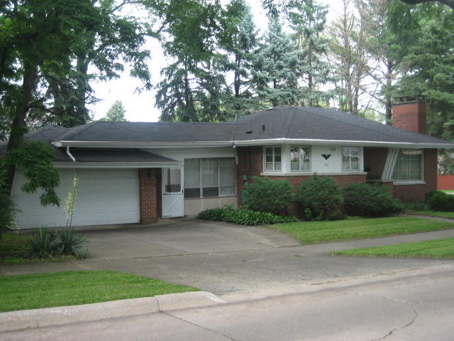 224 East Harrison Road Lombard, IL 60148 - Photo 1 of 24 a front view of a house with a garden and yard
