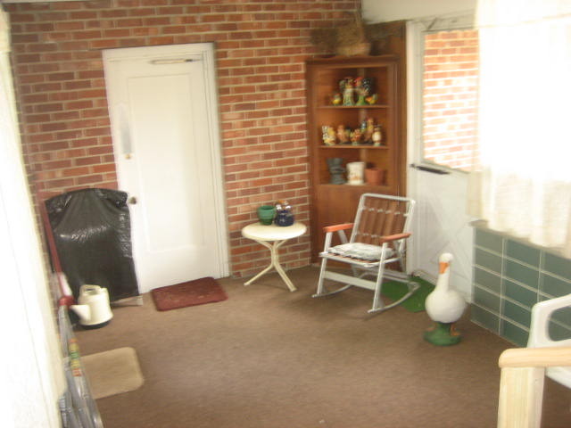 224 East Harrison Road Lombard, IL 60148 - Photo 16 of 24 a white chair sitting in a bathroom next to a window