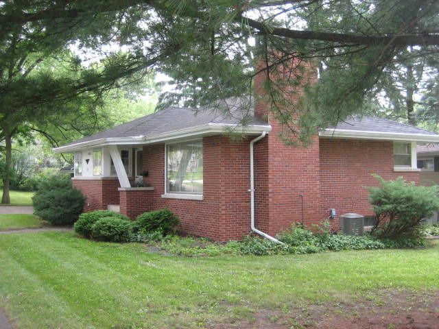 224 East Harrison Road Lombard, IL 60148 - Photo 19 of 24 a front view of a house with a yard and garage