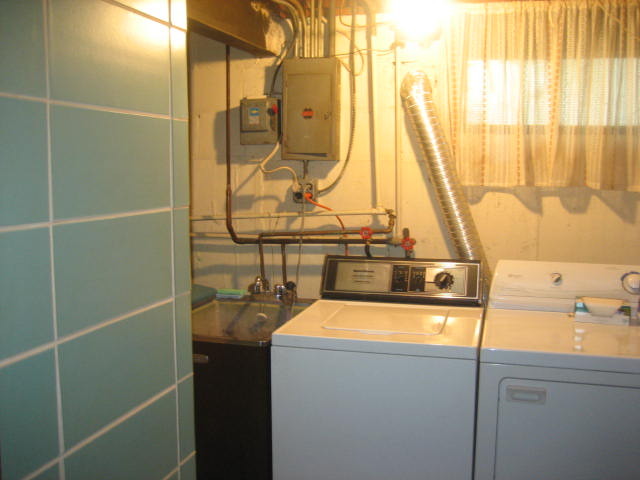 224 East Harrison Road Lombard, IL 60148 - Photo 9 of 24 a bathroom with a sink and mirror next to a window