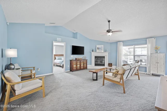 a kitchen with stainless steel appliances granite countertop a refrigerator a sink a stove and island