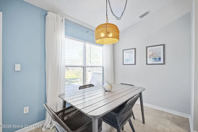 a kitchen with stainless steel appliances kitchen island granite countertop a sink dishwasher stove and refrigerator