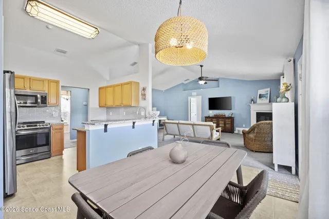 a bedroom with a bed and a ceiling fan