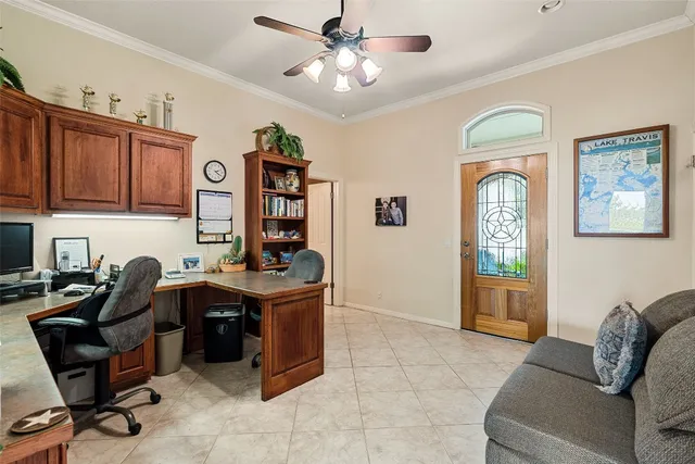 a livingroom with workspace couch and a window