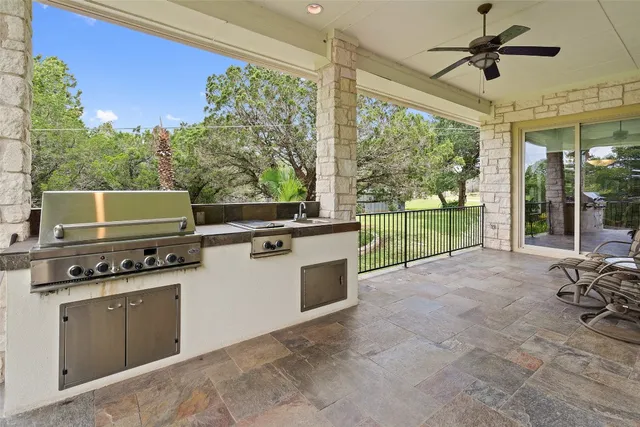 a kitchen with a stove a sink and a refrigerator