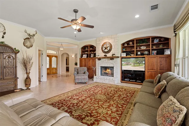 a living room with furniture and a fireplace