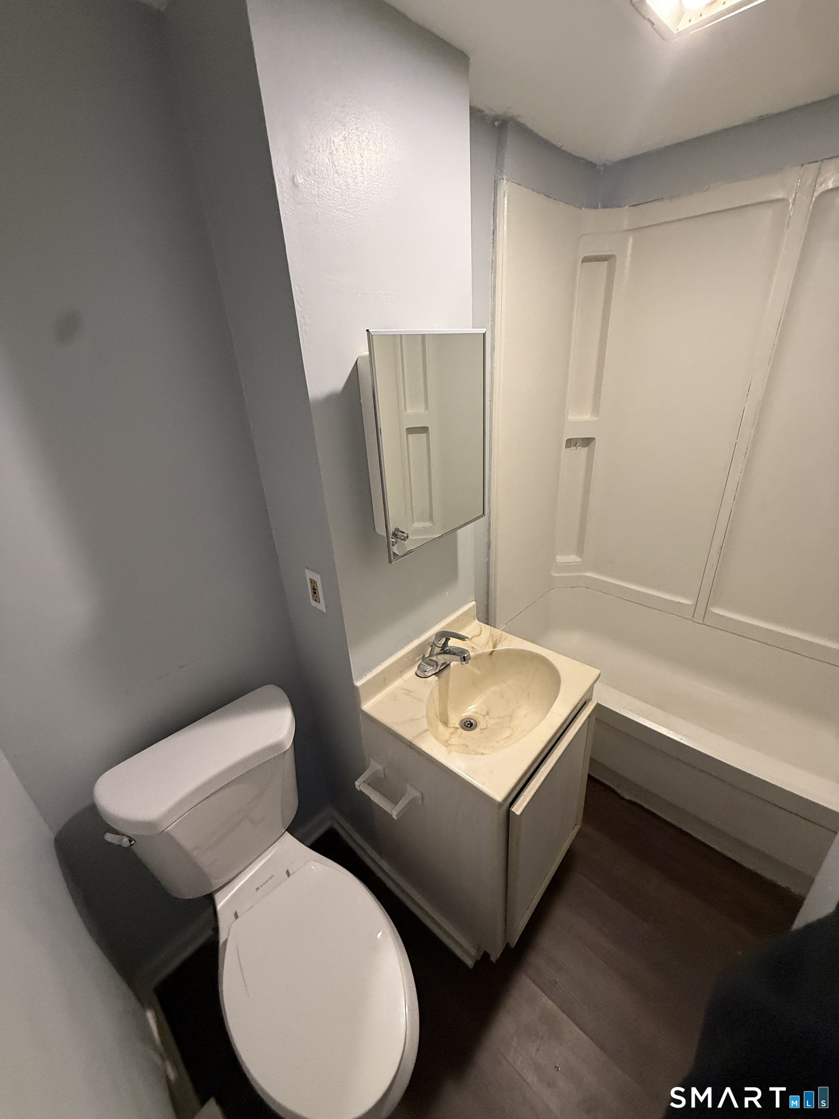 52 Crown Street Naugatuck, CT 06770 - Photo 8 of 11 a bathroom with a toilet sink and mirror