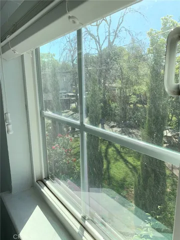 a view of a glass door and a window