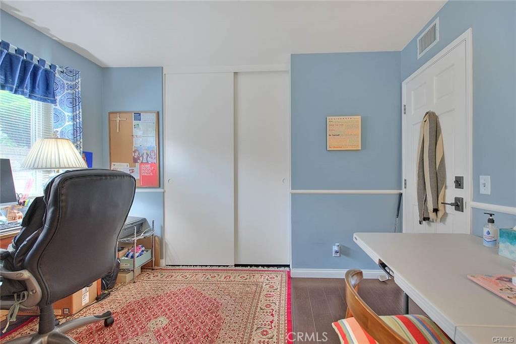 1449 Rolling Knoll Road Diamond Bar, CA 91765 - Photo 16 of 31 a room with a couch and a workspace