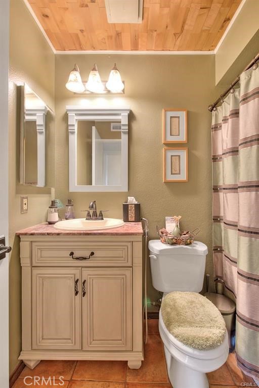 1449 Rolling Knoll Road Diamond Bar, CA 91765 - Photo 17 of 31 a bathroom with a toilet sink and mirror