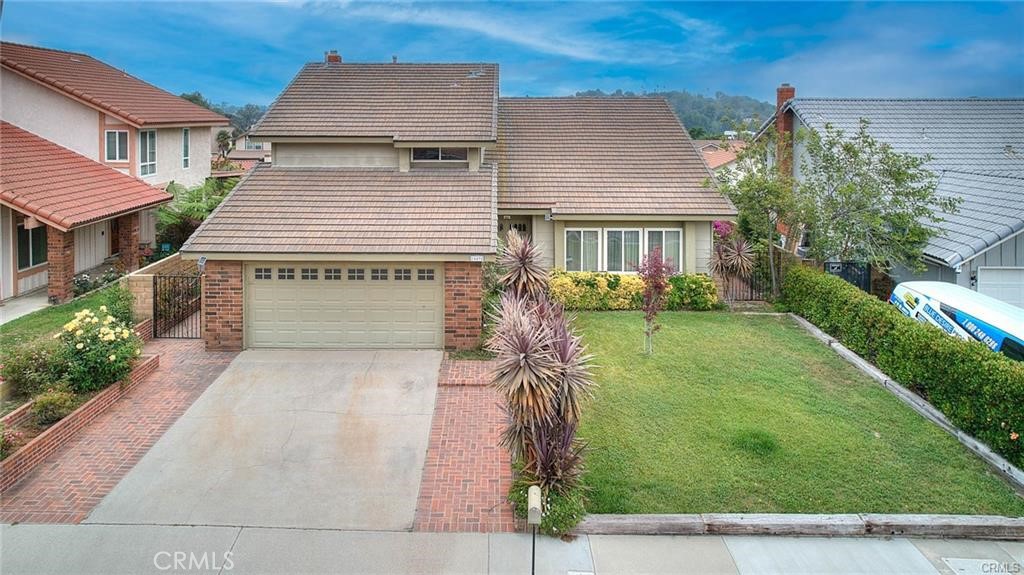 1449 Rolling Knoll Road Diamond Bar, CA 91765 - Photo 2 of 31 front view of a house with a yard