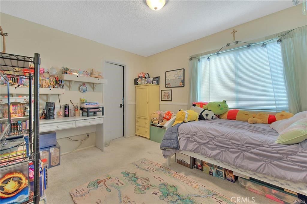 1449 Rolling Knoll Road Diamond Bar, CA 91765 - Photo 23 of 31 a bedroom with a bed and a cabinets