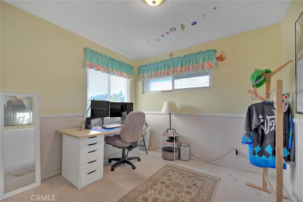 1449 Rolling Knoll Road Diamond Bar, CA 91765 - Photo 24 of 31 a view of a workspace with furniture and a window