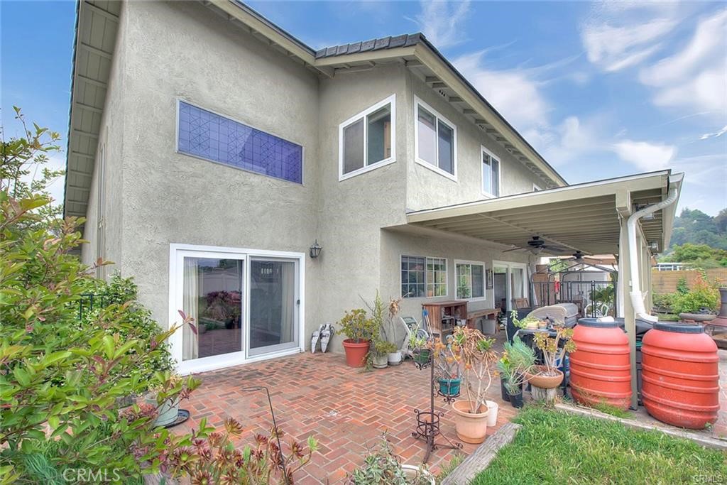 1449 Rolling Knoll Road Diamond Bar, CA 91765 - Photo 30 of 31 a front view of a house with porch and garden