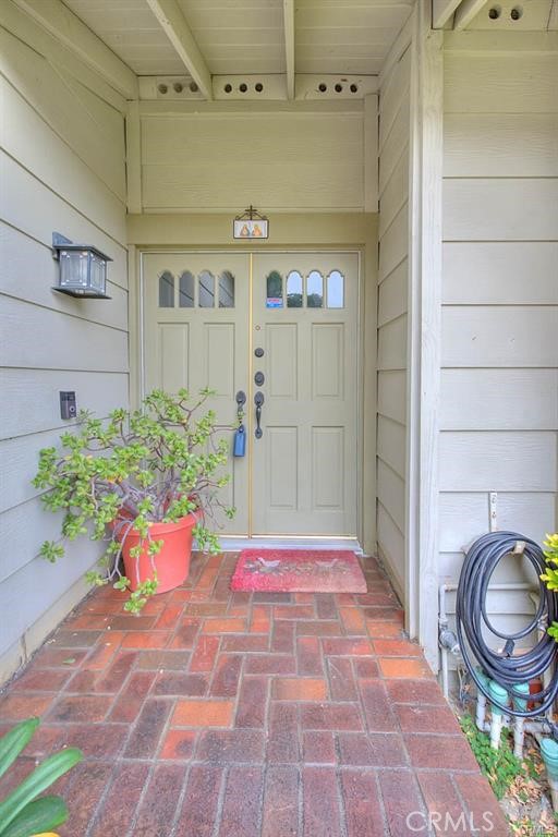 1449 Rolling Knoll Road Diamond Bar, CA 91765 - Photo 3 of 31 a backyard of a house with potted plants