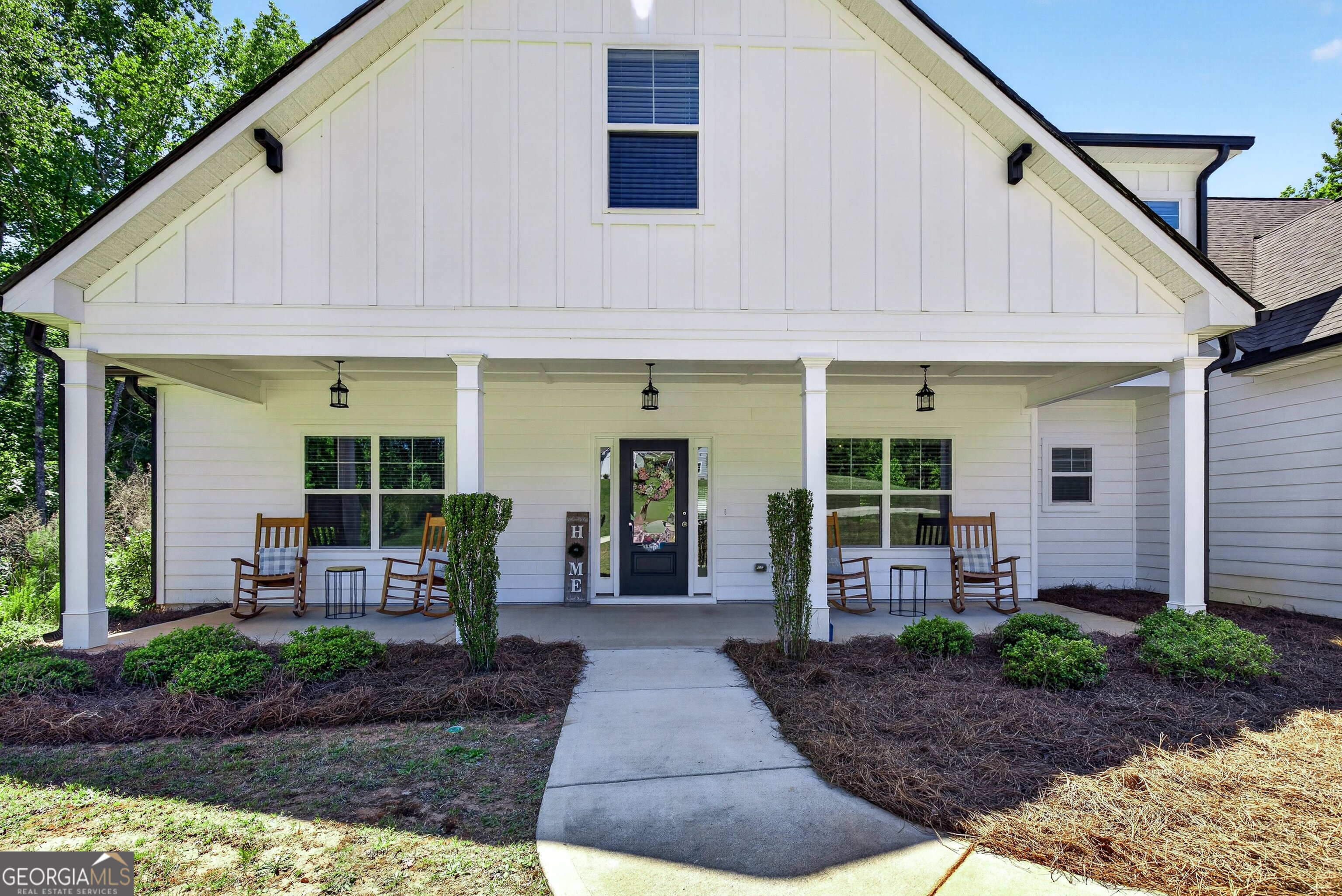 1764 Luther Bailey Road Senoia, GA 30276 - Photo 9 of 63 a front view of a house with garden and plants