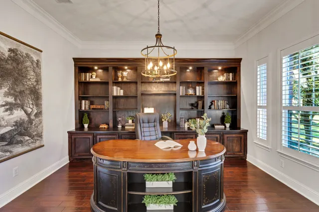 a kitchen with a sink a stove and chairs