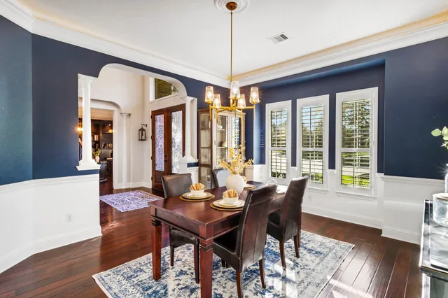 a dining hall with stainless steel appliances granite countertop a sink and a granite counter tops