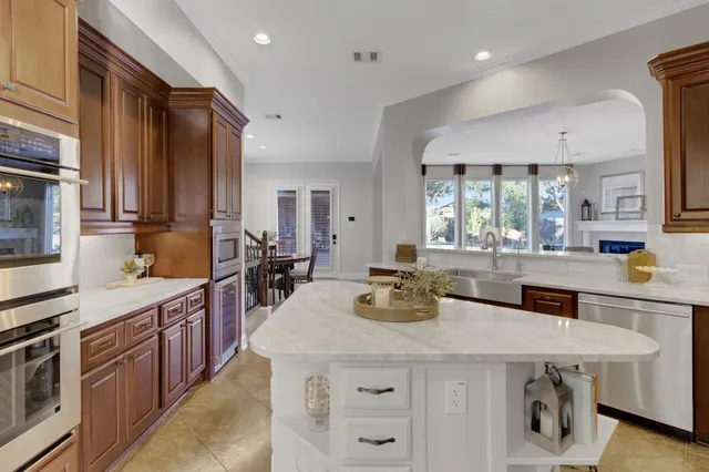 a view of a dining room with furniture and a window