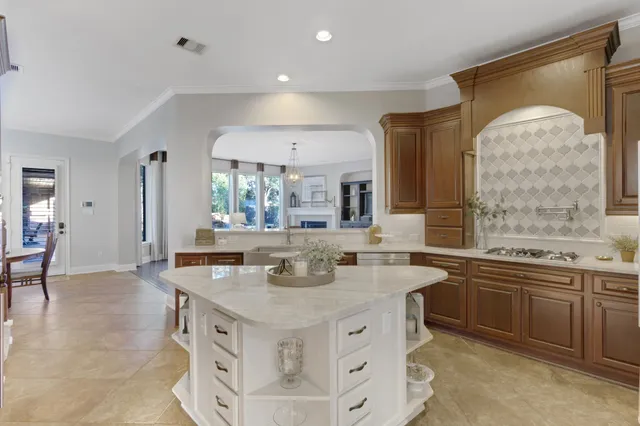a view of a dining room with furniture and a window