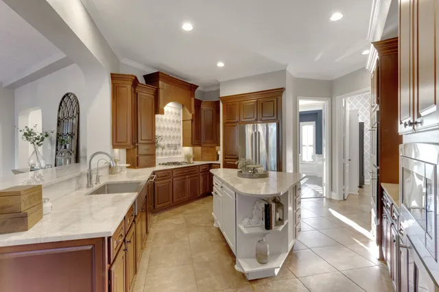 a view of a workspace with furniture and window