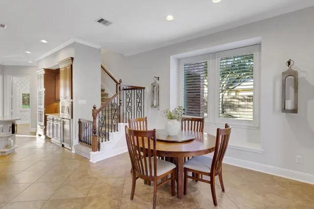 a living room with fireplace furniture and a wooden floor