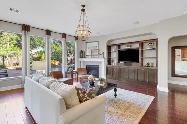 a bedroom with furniture and a fireplace