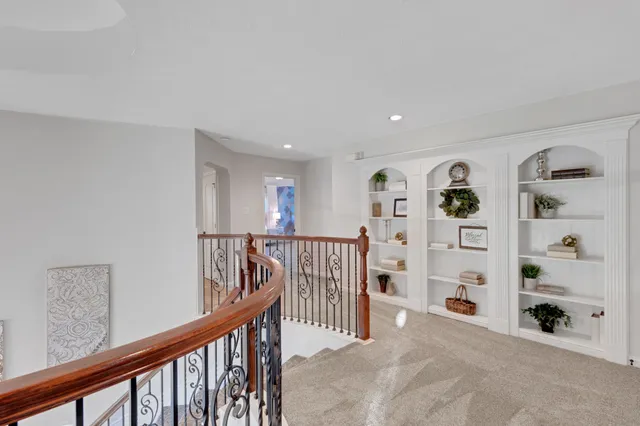 a living room with furniture pool table and flat screen tv