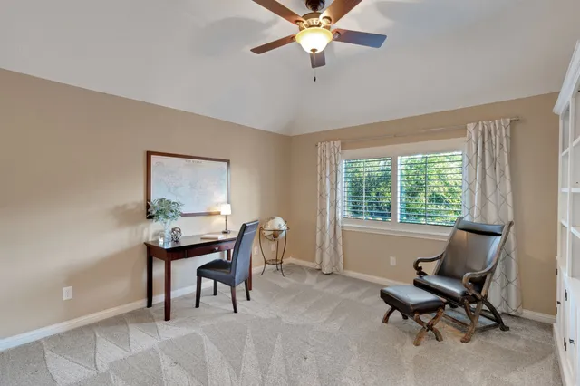 a kitchen with kitchen island granite countertop lots of white stainless steel appliances