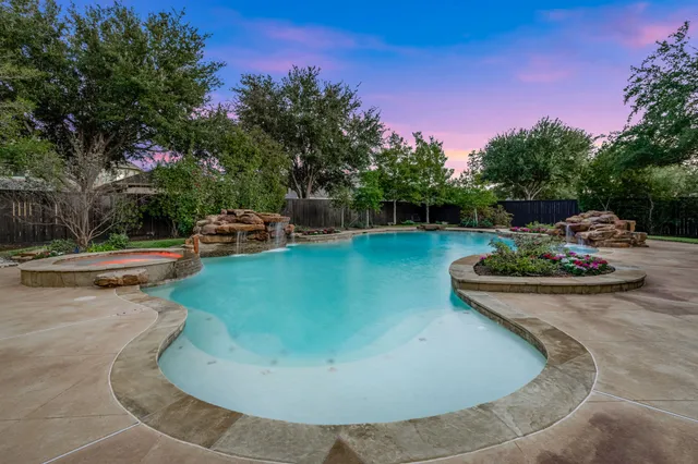 a view of a swimming pool with sitting area