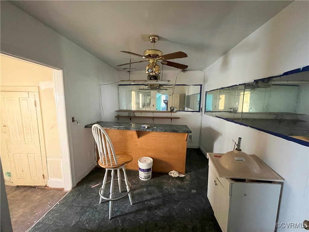 919-921 Rome Street Petersburg, VA 23803 - Photo 4 of 21 a living room with a couch and a chandelier