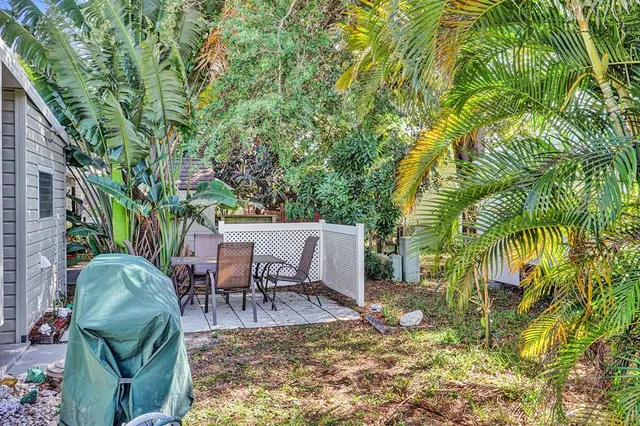a view of a chairs and table in the patio
