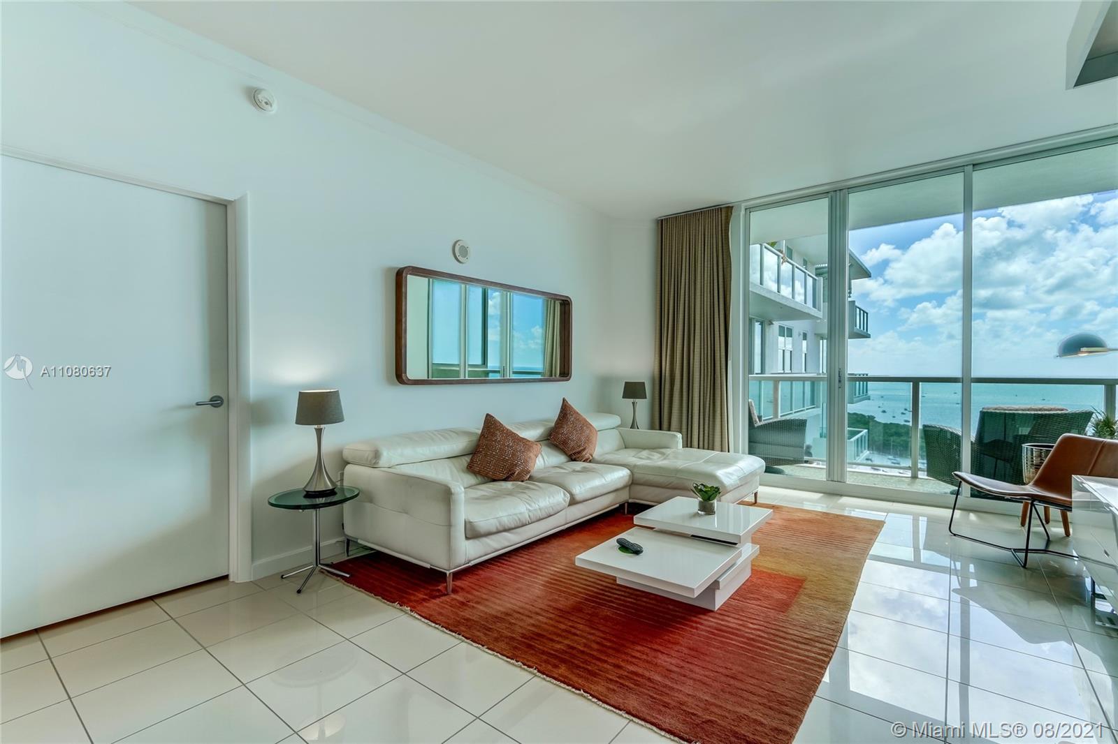 2889 McFarlane Road, Unit 2114 Coconut Grove, FL 33133 - Photo 3 of 15 a living room with furniture and a window