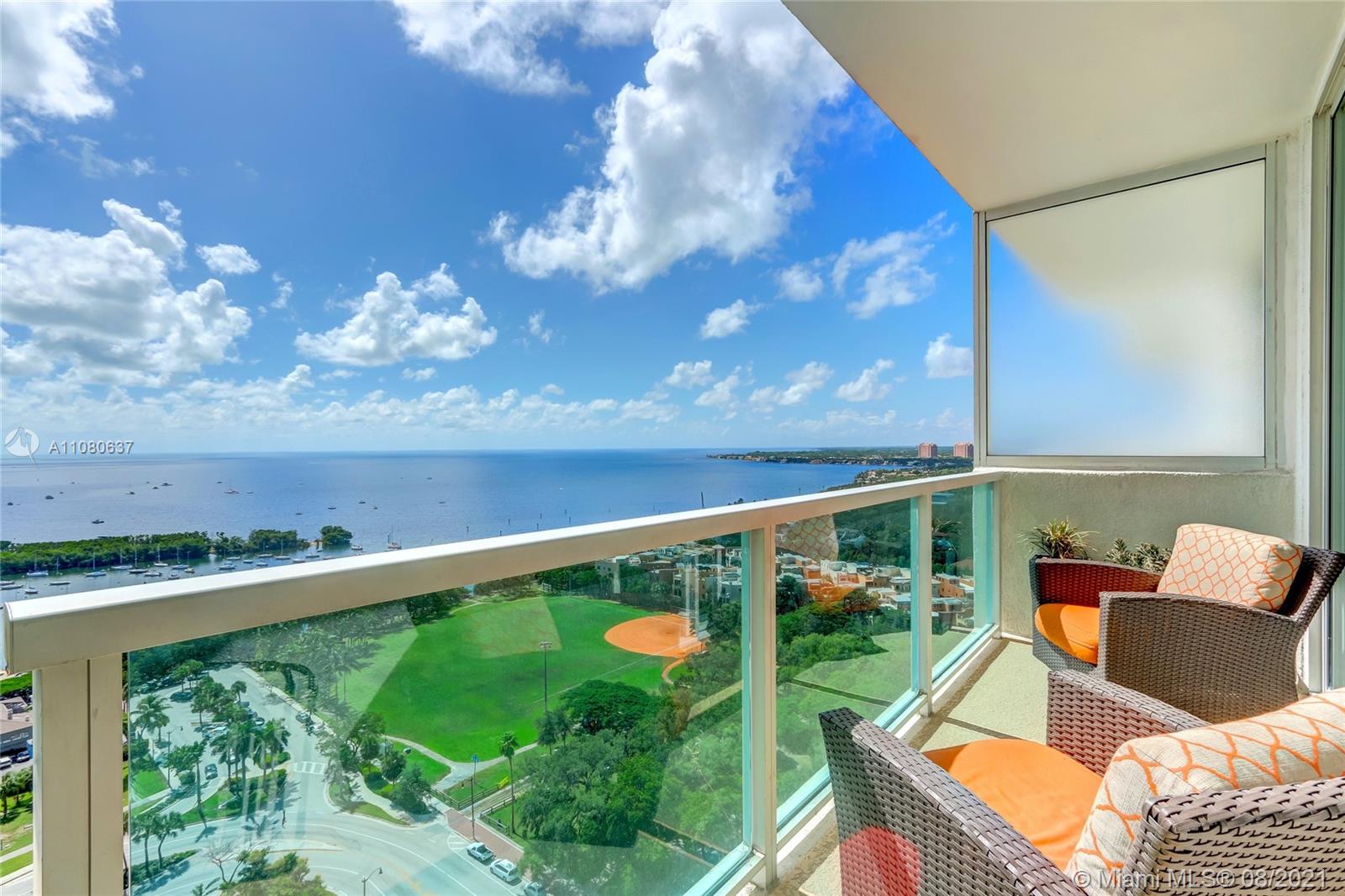 2889 McFarlane Road, Unit 2114 Coconut Grove, FL 33133 - Photo 7 of 15 a view of a chairs and table in the balcony